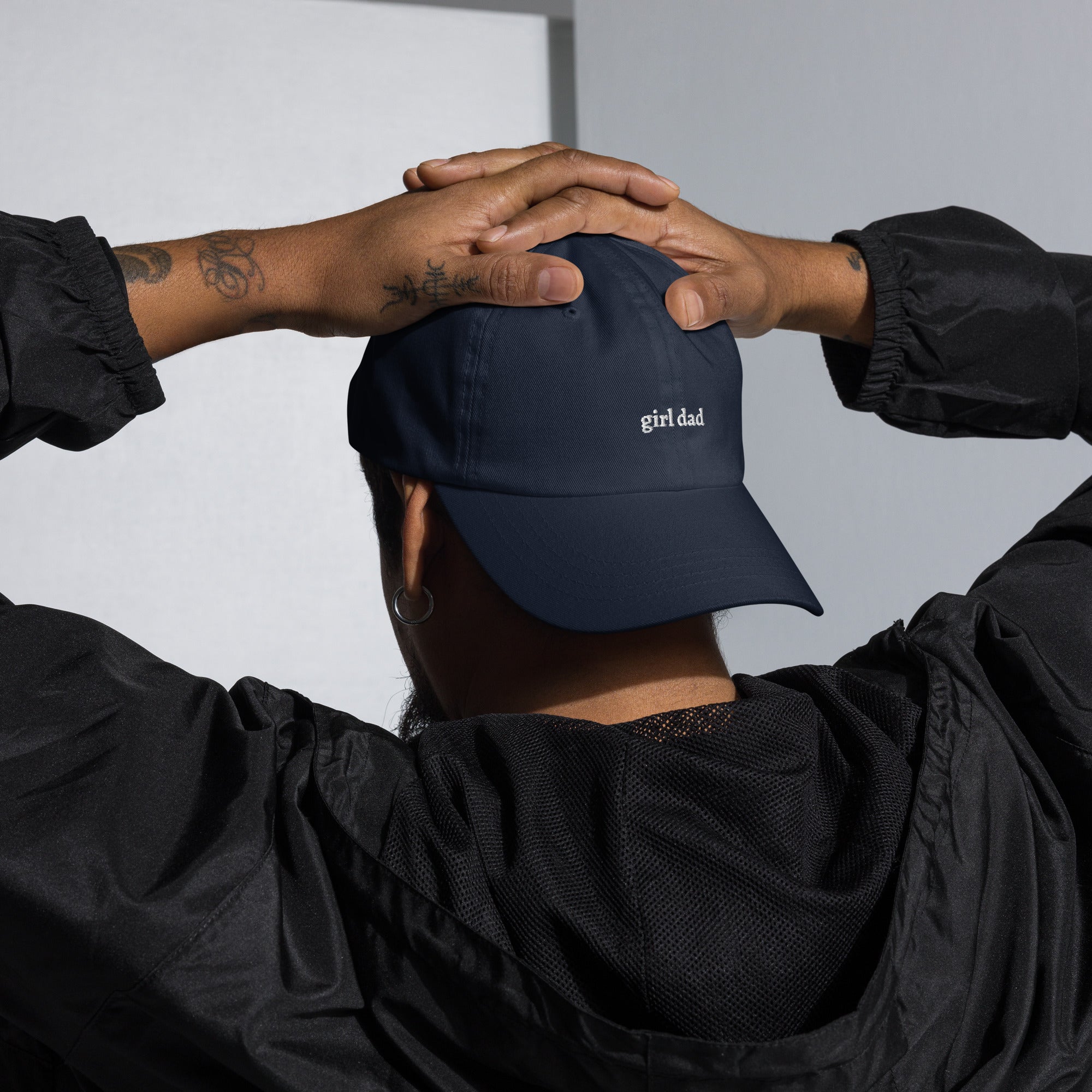 Man wearing Navy Black embroidered "girl dad" dad hat front view