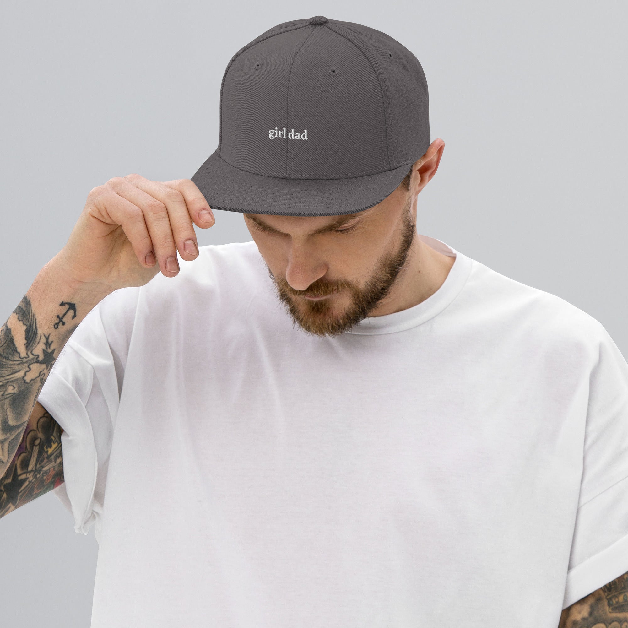 Dark grey embroidered "girl dad" snapback hat side view | Plot Twist